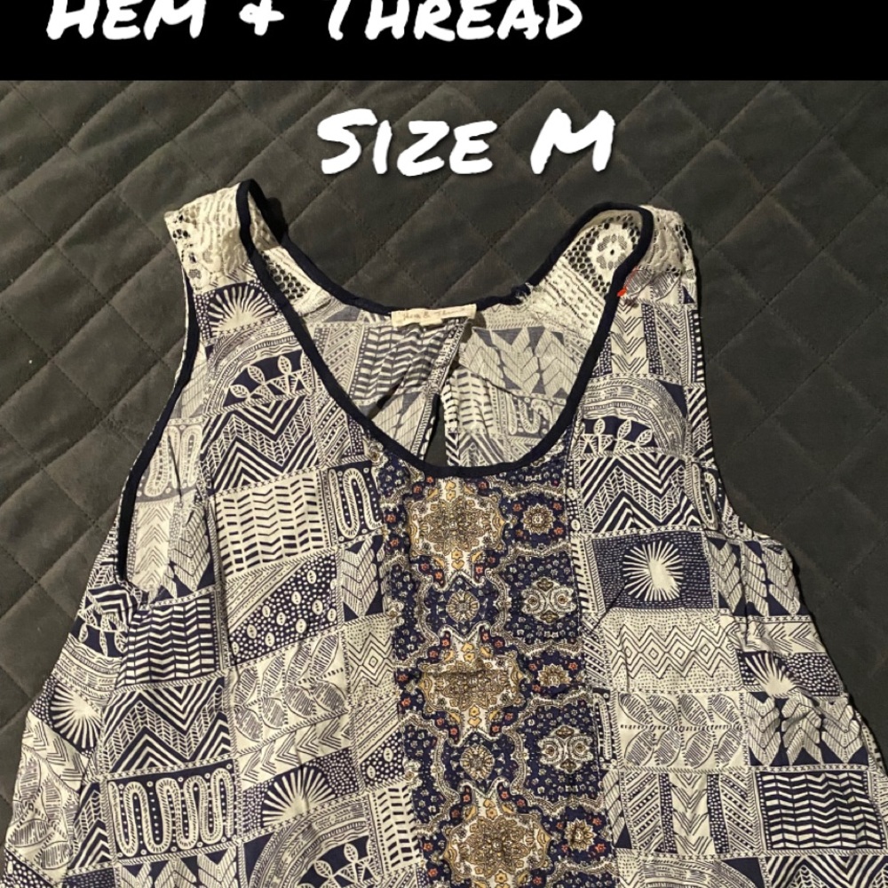 Thick tank top with pretty design and open slit in the back^